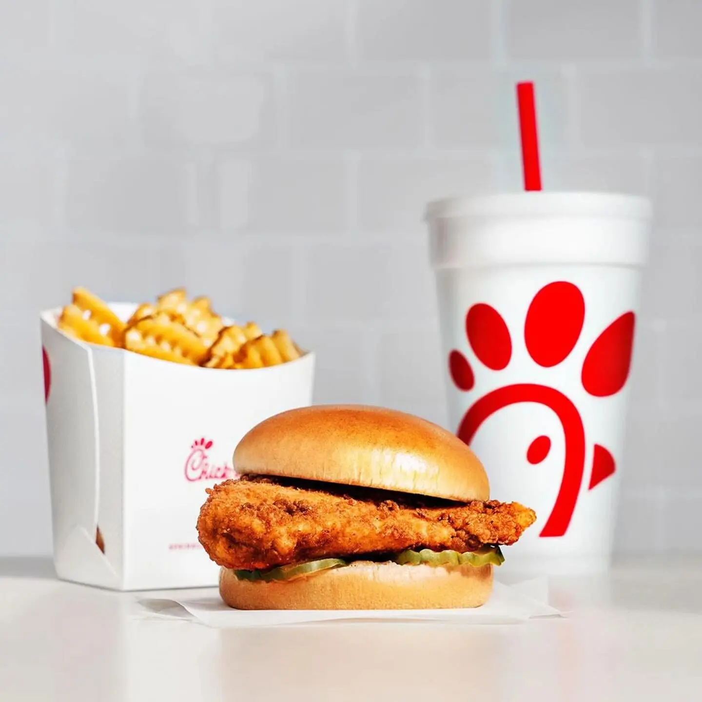 Chicken sandwich, waffle fries and beverage